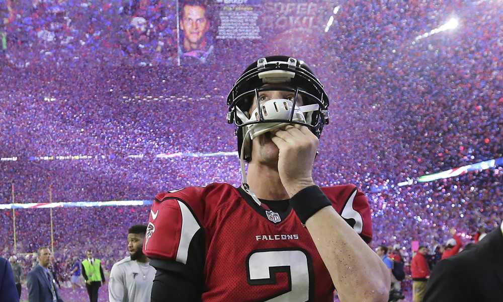 February 5, 2017, Houston: Falcons quarterback Matt Ryan reacts to losing the Super Bowl as the screen flashes Patriots quarterback Tom Brady and the confetti flys in a 34-28 loss on Sunday Feb. 5, 2017, in Houston. Curtis Compton/ccompton@ajc.com