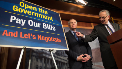 Sen. Charles Schumer and Senate Majority Leader Harry Reid speak about the government shutdown at a news conference Oct. 12, 2013. (credit: Getty Images)