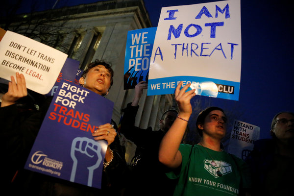 Transgender activists and supporters protest potential changes by the Trump administration in federal guidelines issued to public schools in defense of transgender student rights, near the White House in Washington, U.S. February 22, 2017. REUTERS/Jonathan Ernst