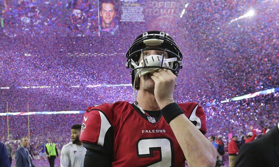February 5, 2017, Houston: Falcons quarterback Matt Ryan reacts to losing the Super Bowl as the screen flashes Patriots quarterback Tom Brady and the confetti flys in a 34-28 loss on Sunday Feb. 5, 2017, in Houston.    Curtis Compton/ccompton@ajc.com