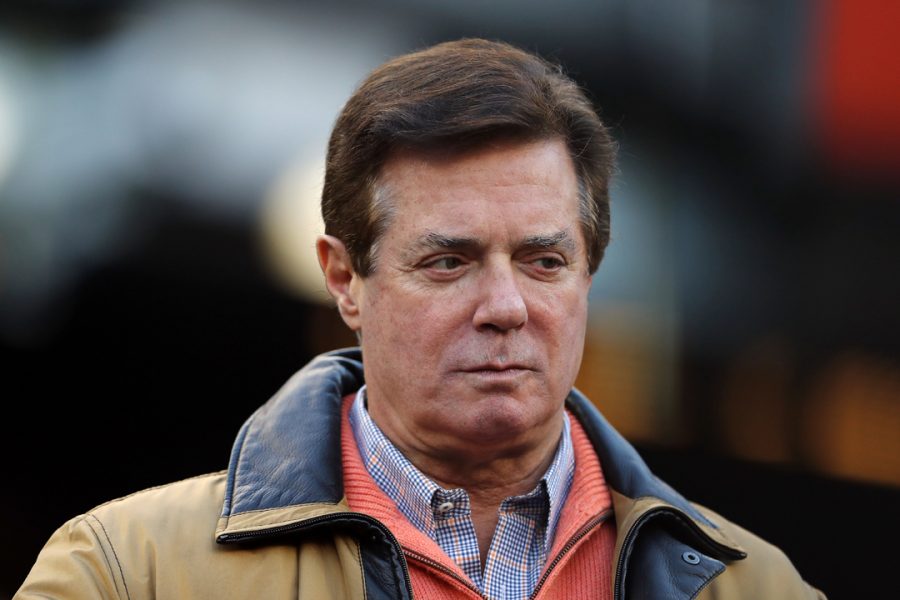 NEW YORK, NEW YORK - OCTOBER 17: Former Donald Trump presidential campaign manager Paul Manafort looks on during Game Four of the American League Championship Series at Yankee Stadium on October 17, 2017 in the Bronx borough of New York City. (Photo by Elsa/Getty Images)